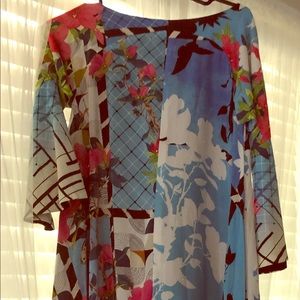Adorable multi-color dress with lining.